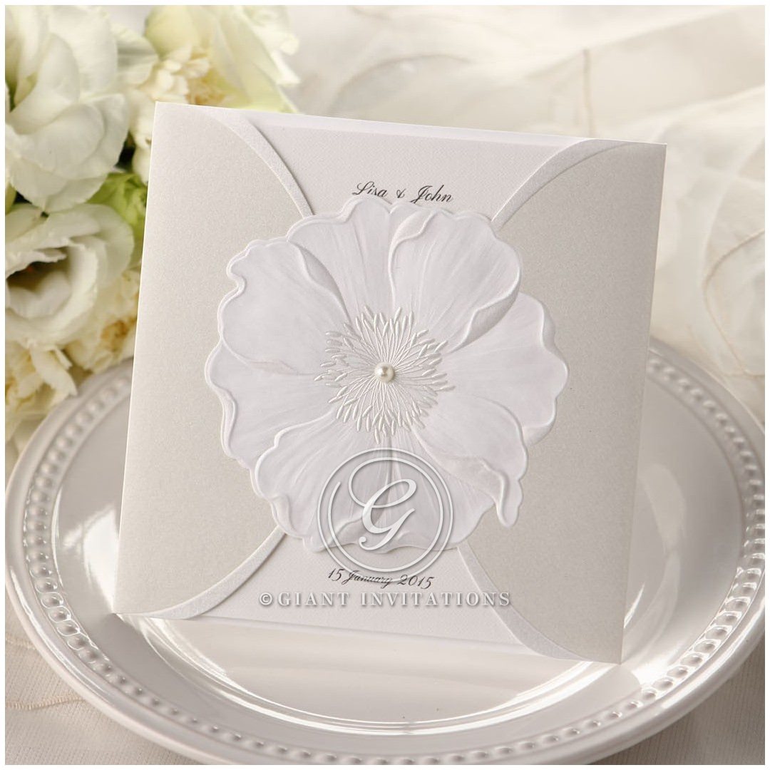 Classic trifold card printed in customisable calligraphic lettering enclosed in a sophisticated silk screened pocket with an embossed flower adorned with a shiny pearl
